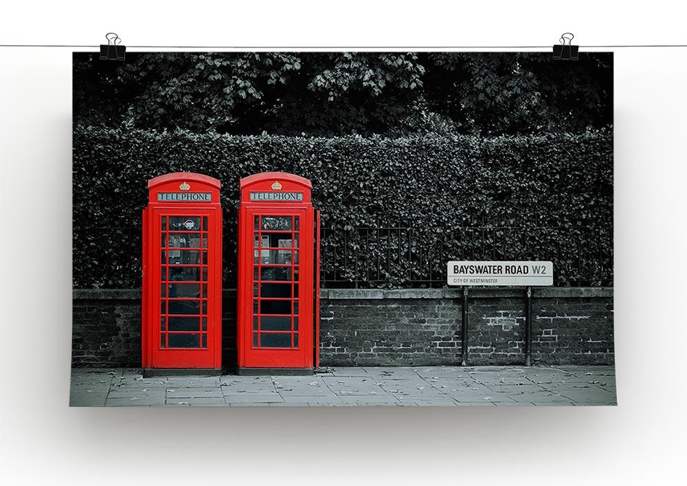 Telephone box in London street Poster - Unframed