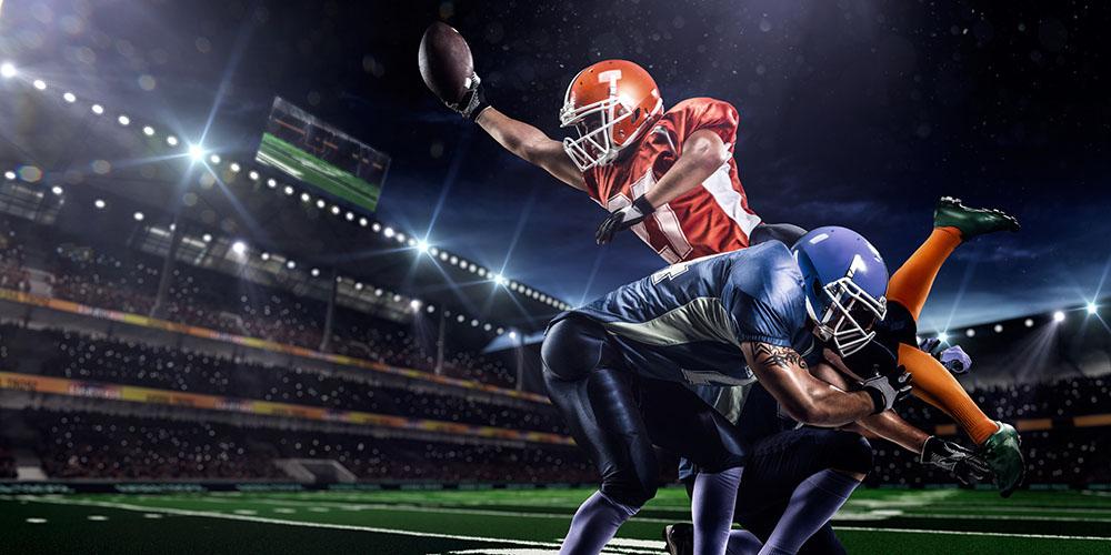 American football player in action on the stadium Wall Mural Wallpaper - Canvas Art Rocks - 1