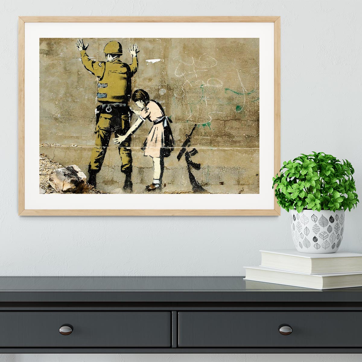 Banksy Girl and Soldier Framed Print