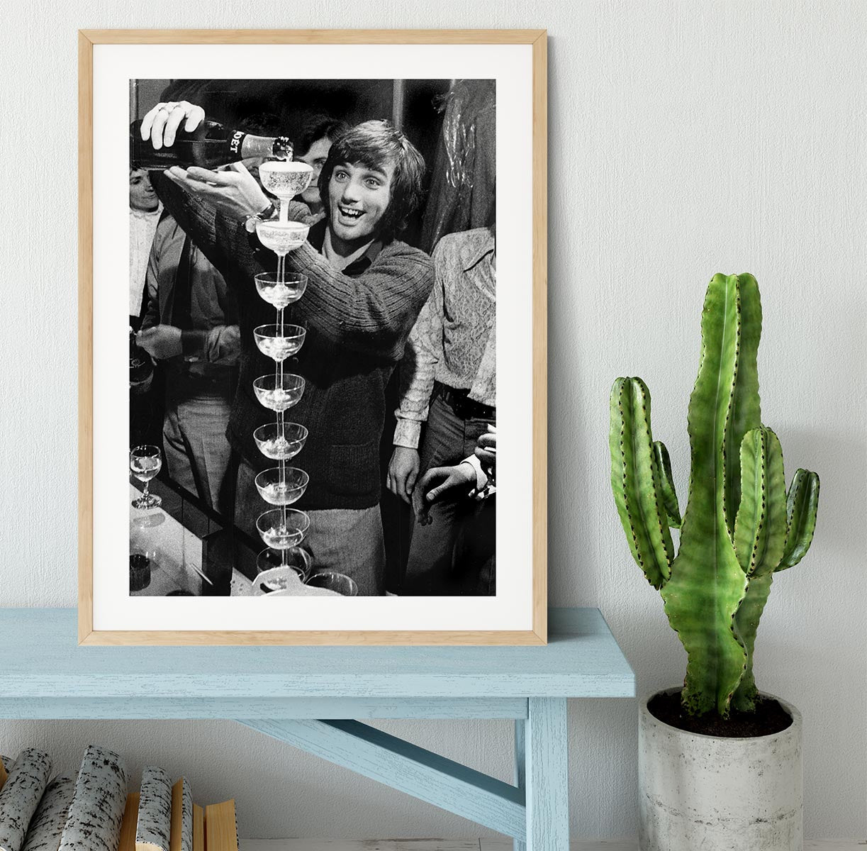 George Best pouring champagne Framed Print - Canvas Art Rocks - 3