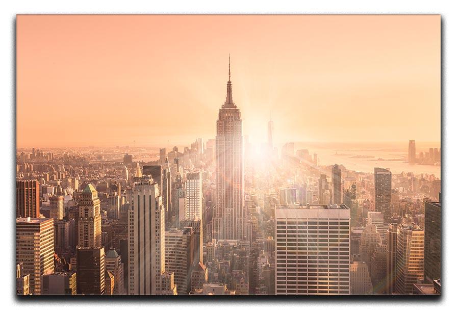 Manhattan downtown skyline with illuminated Empire State Building Canvas Print or Poster - Canvas Art Rocks - 1