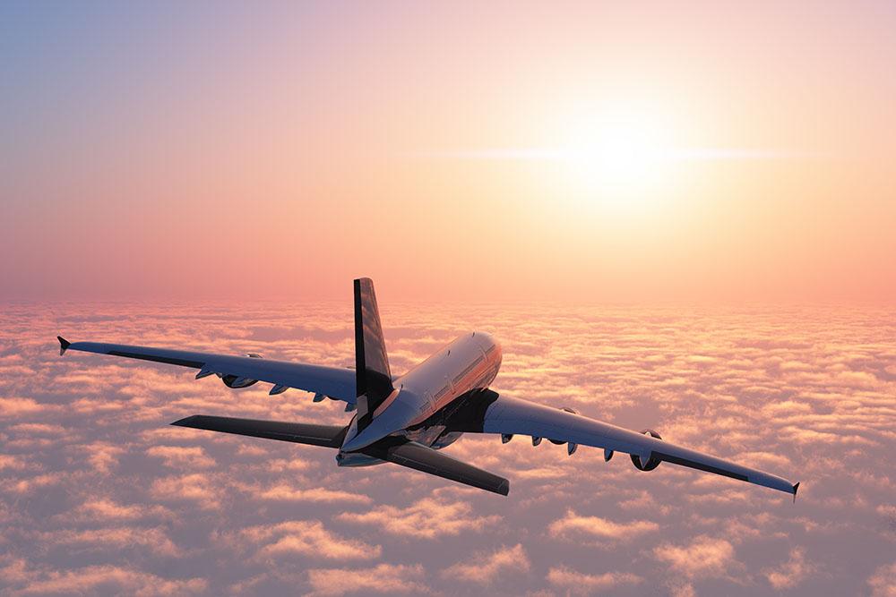 Passenger plane above the clouds Wall Mural Wallpaper - Canvas Art Rocks - 1
