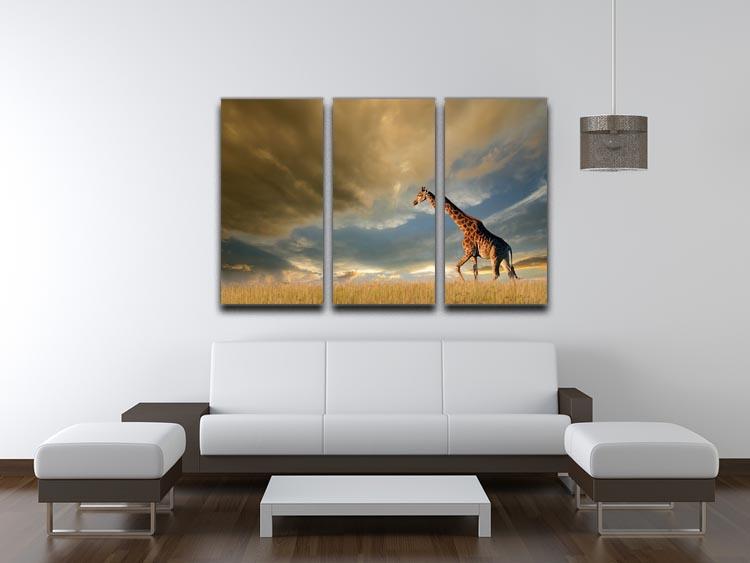 A giraffe walking on the African plains against a dramatic sky 3 Split Panel Canvas Print - Canvas Art Rocks - 3