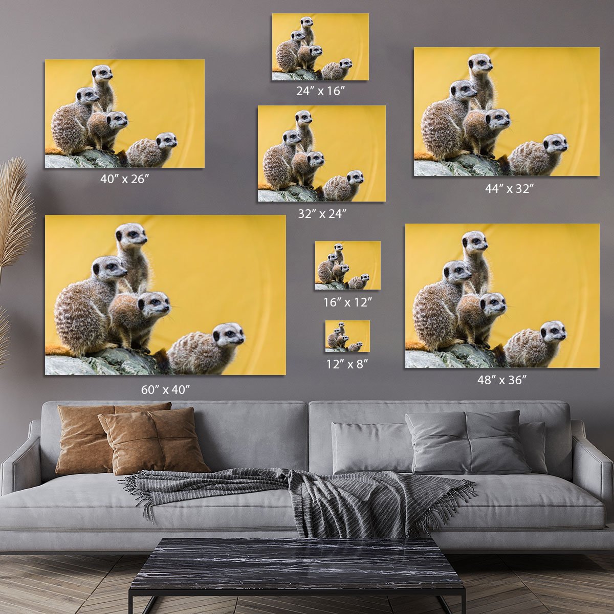 A group of meerkats seen on top of a rock Canvas Print or Poster