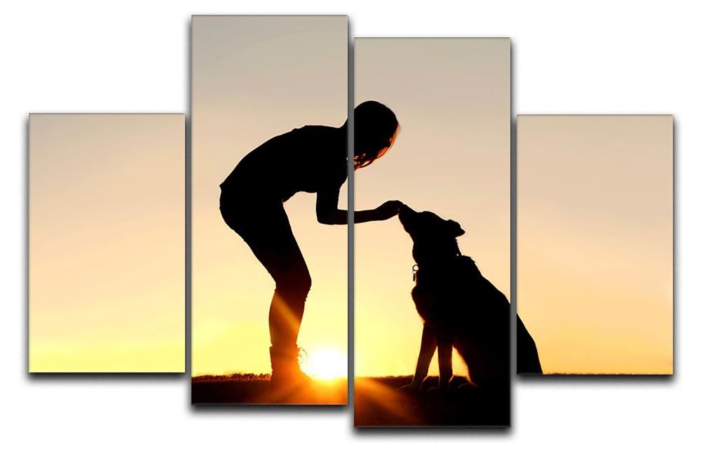 A silhouette of a girl sitting outside in the grass with her pet German Shepherd Mix Dog feeding him treats during training in front of a sunsetting sky. 4 Split Panel Canvas - Canvas Art Rocks - 1