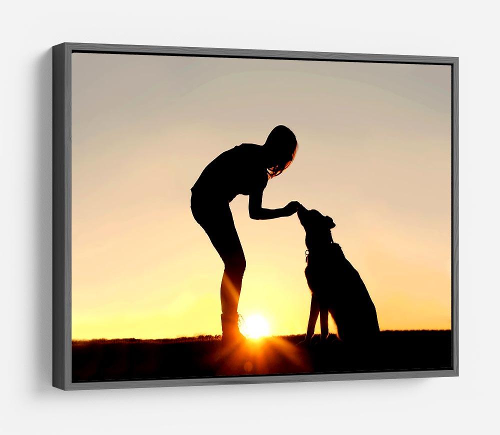 A silhouette of a girl sitting outside in the grass with her pet German Shepherd Mix Dog feeding him treats during training in front of a sunsetting sky. HD Metal Print - Canvas Art Rocks - 9