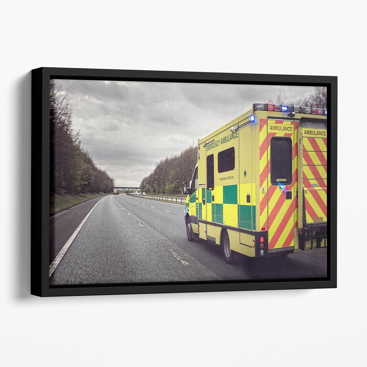 Ambulance responding to an emergency Floating Framed Canvas