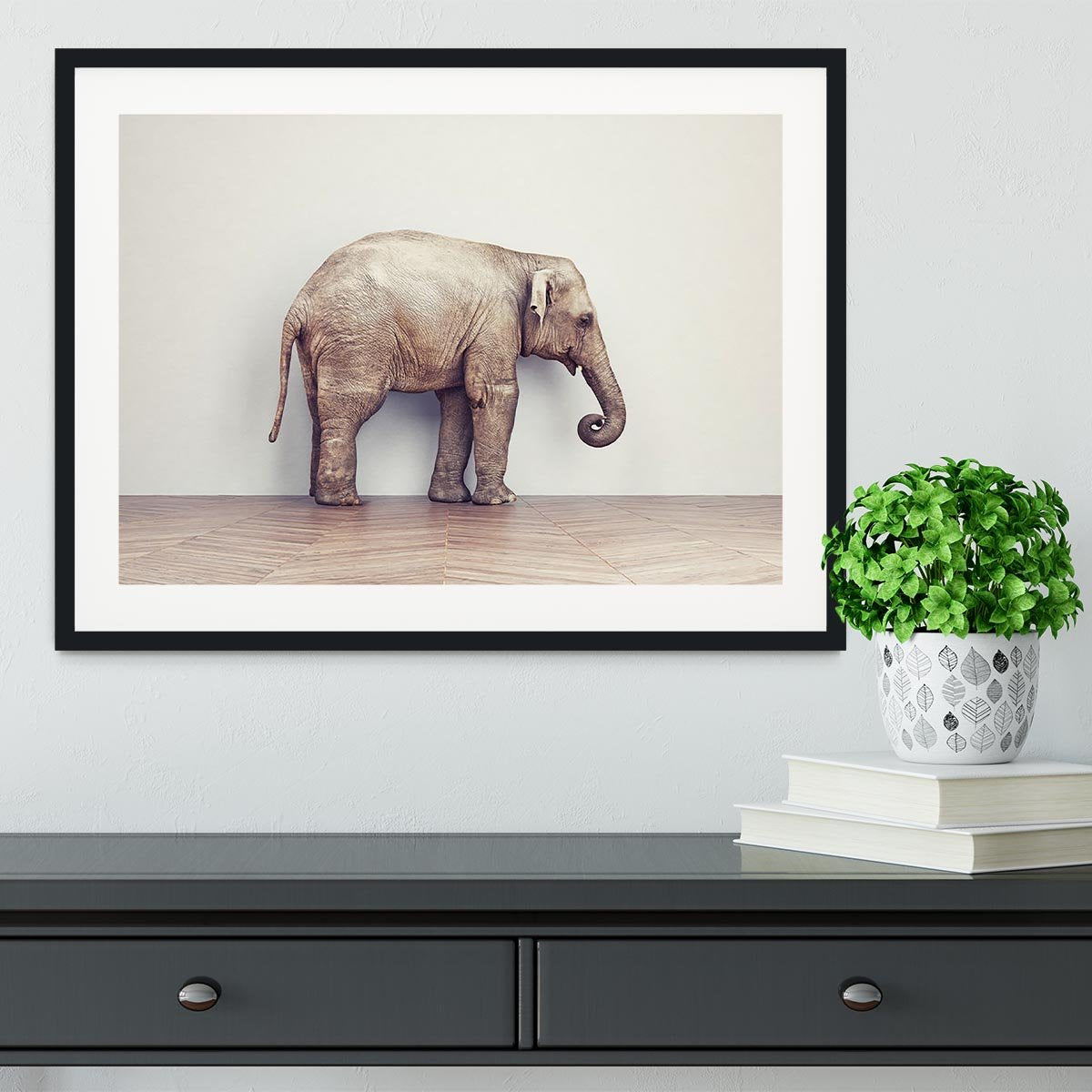 An elephant calm in the room near white wall. Creative concept Framed Print - Canvas Art Rocks - 1