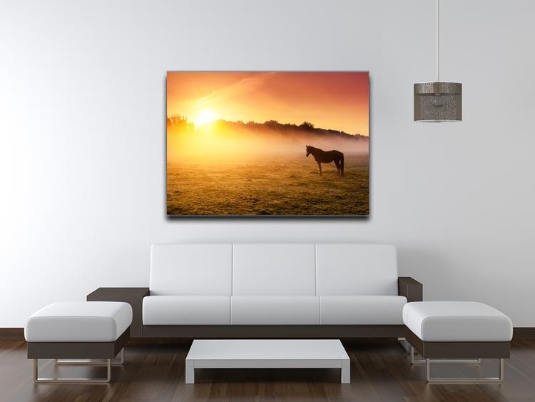Arabian horses grazing on pasture at sundown in orange sunny beams. Dramatic foggy scene Canvas Print or Poster - Canvas Art Rocks - 4