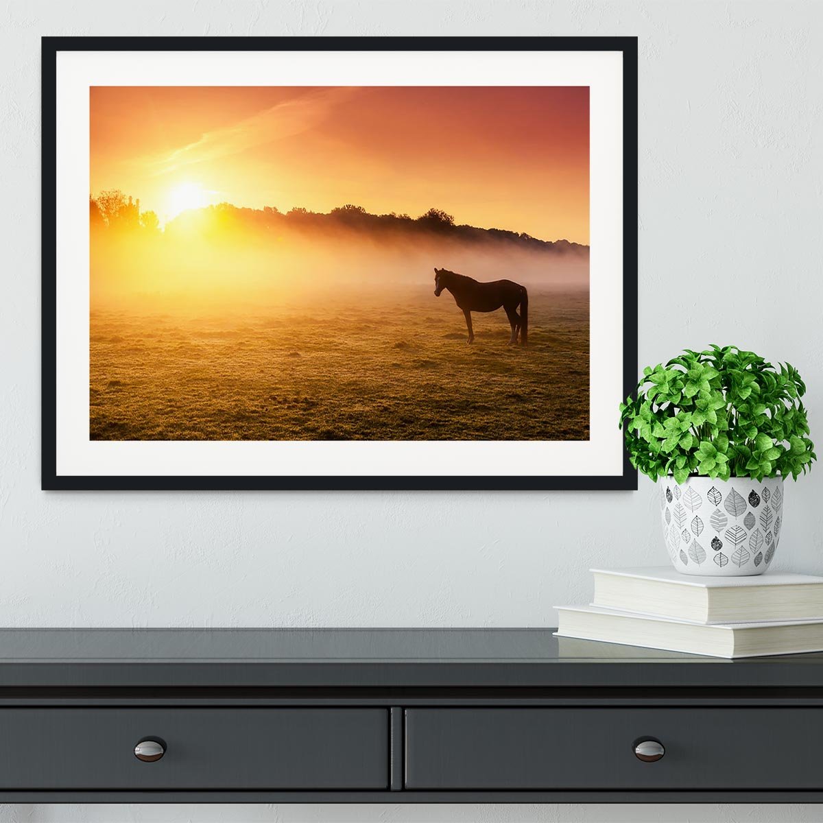 Arabian horses grazing on pasture at sundown in orange sunny beams. Dramatic foggy scene Framed Print - Canvas Art Rocks - 1