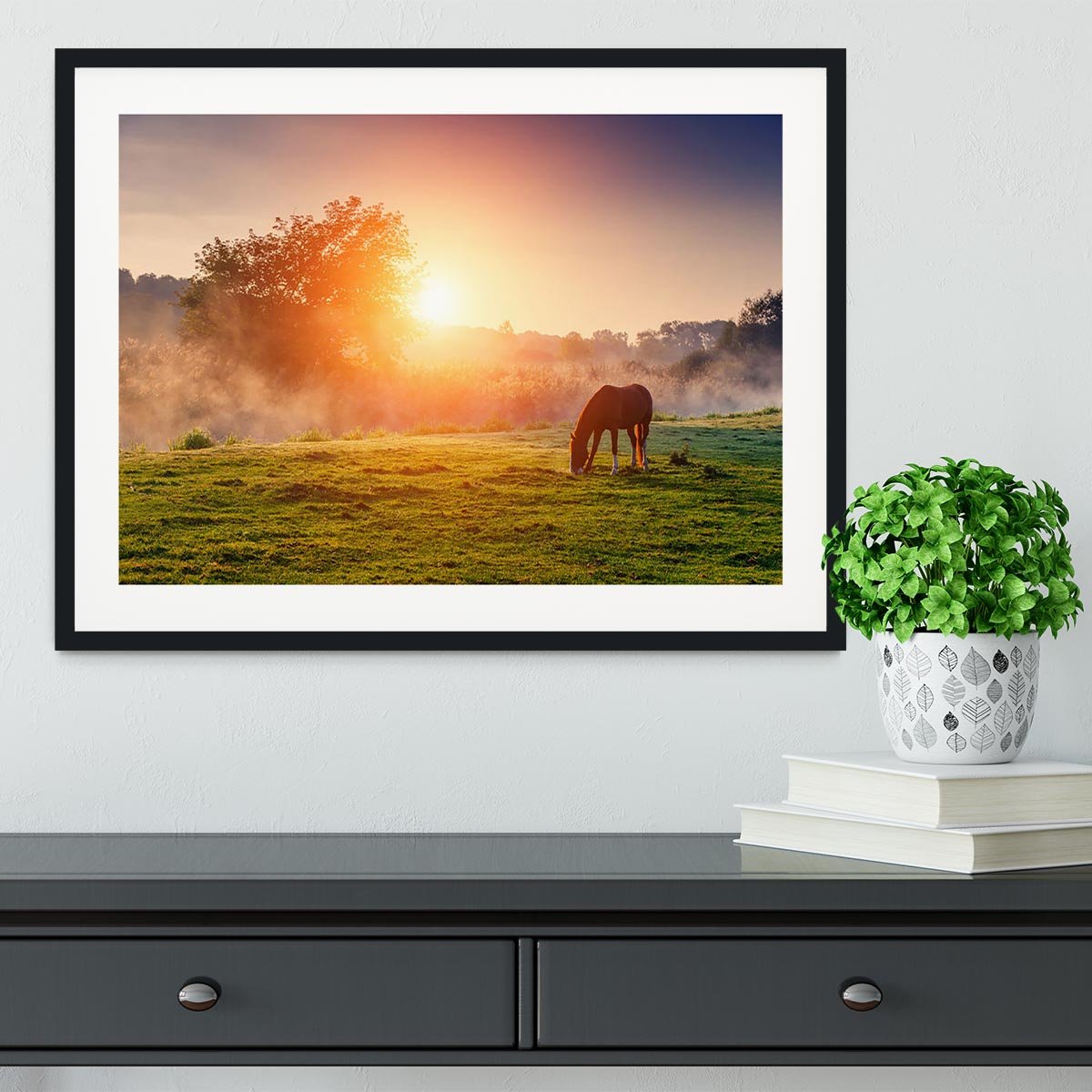 Arabian horses grazing on pasture at sundown in orange sunny beams Framed Print - Canvas Art Rocks - 1