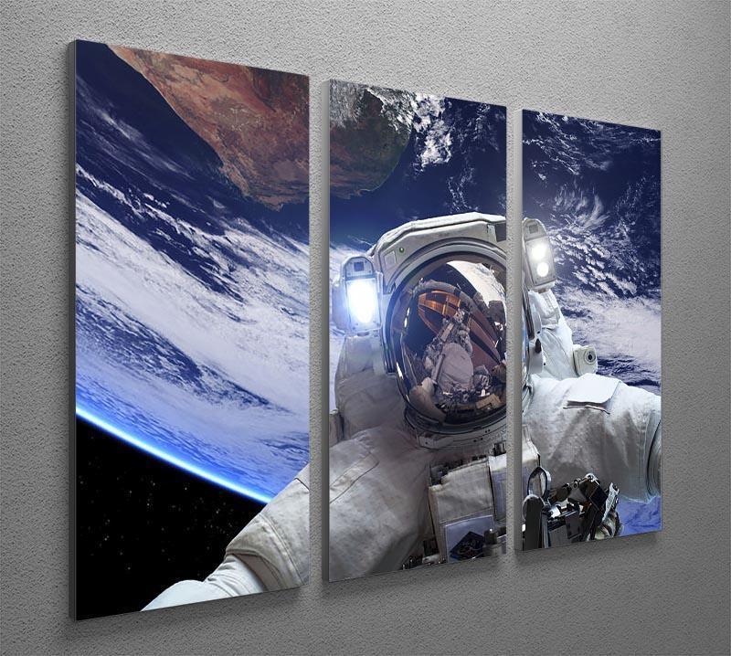 Astronaut in outer space against the backdrop 3 Split Panel Canvas Print - Canvas Art Rocks - 2