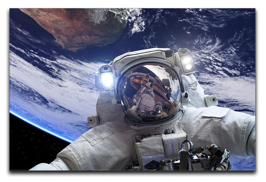 Astronaut in outer space against the backdrop Canvas Print or Poster  - Canvas Art Rocks - 1