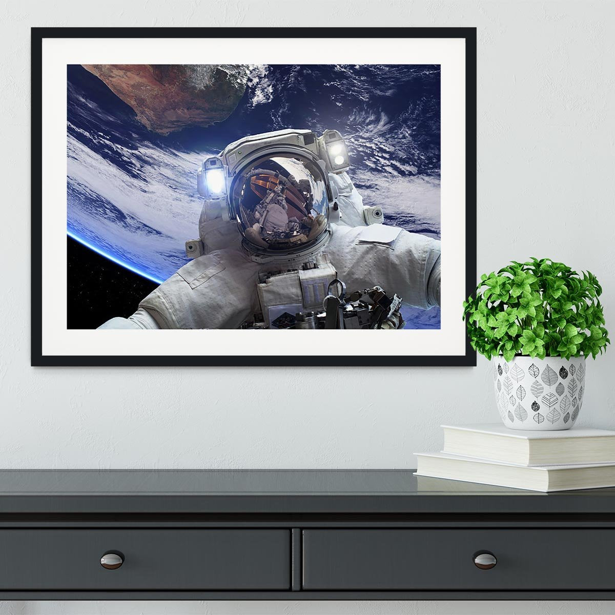 Astronaut in outer space against the backdrop Framed Print - Canvas Art Rocks - 1