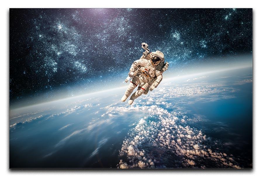 Astronaut in outer space planet earth Canvas Print or Poster  - Canvas Art Rocks - 1