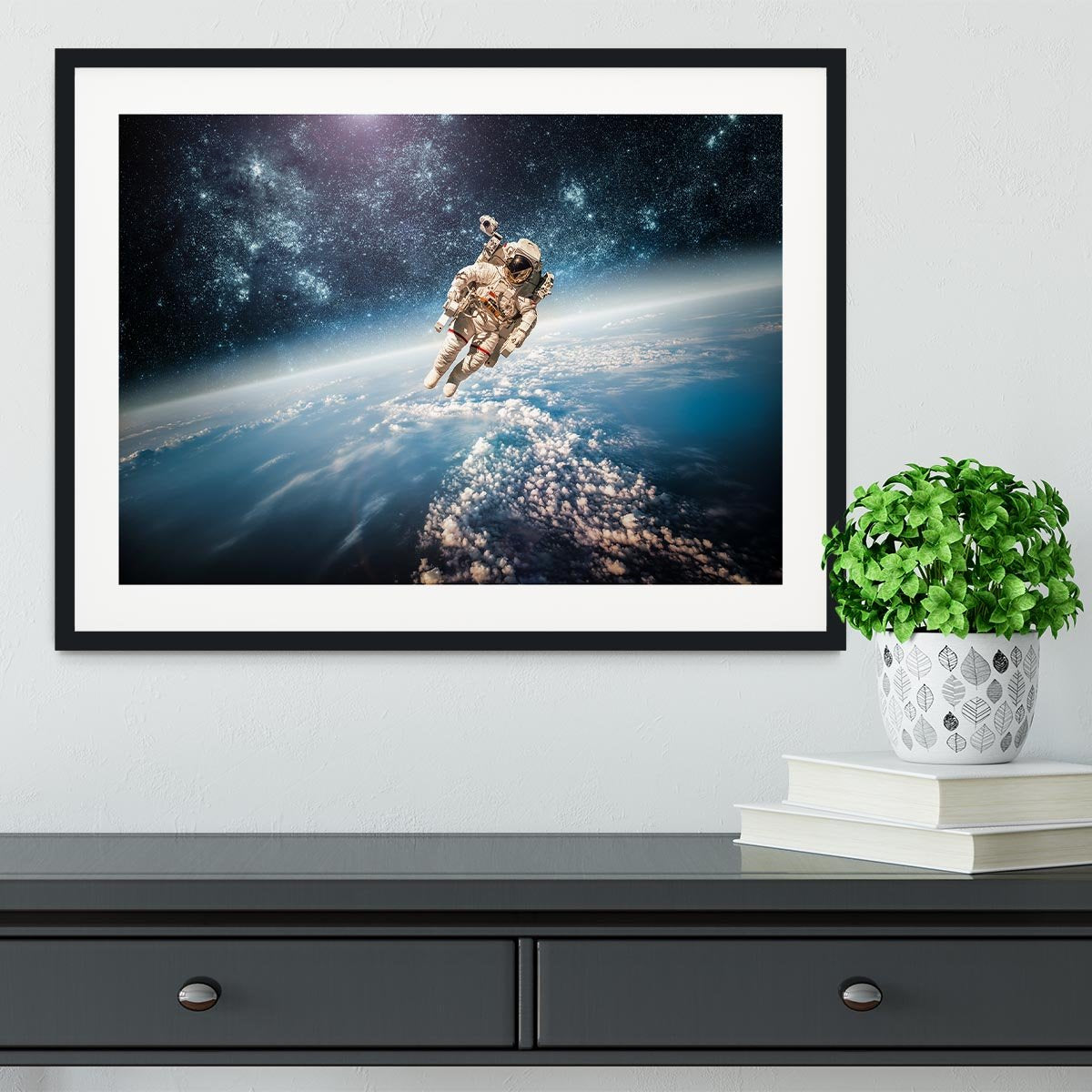 Astronaut in outer space planet earth Framed Print - Canvas Art Rocks - 1