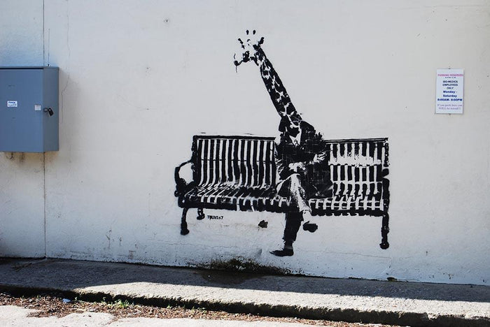 Banksy Giraffe on a Bench Wall Mural Wallpaper
