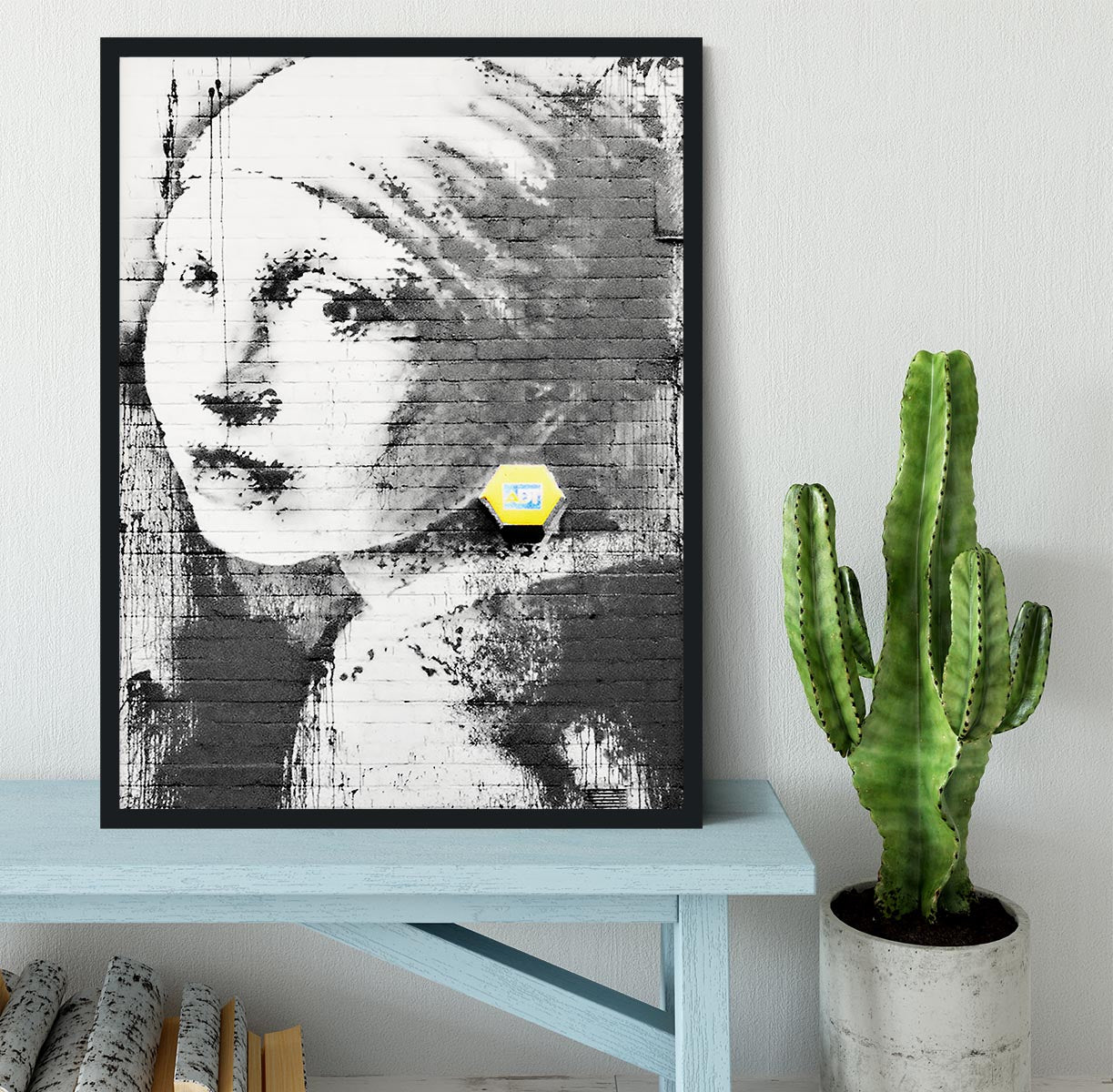 Banksy Girl With a Pierced Eardrum Framed Print