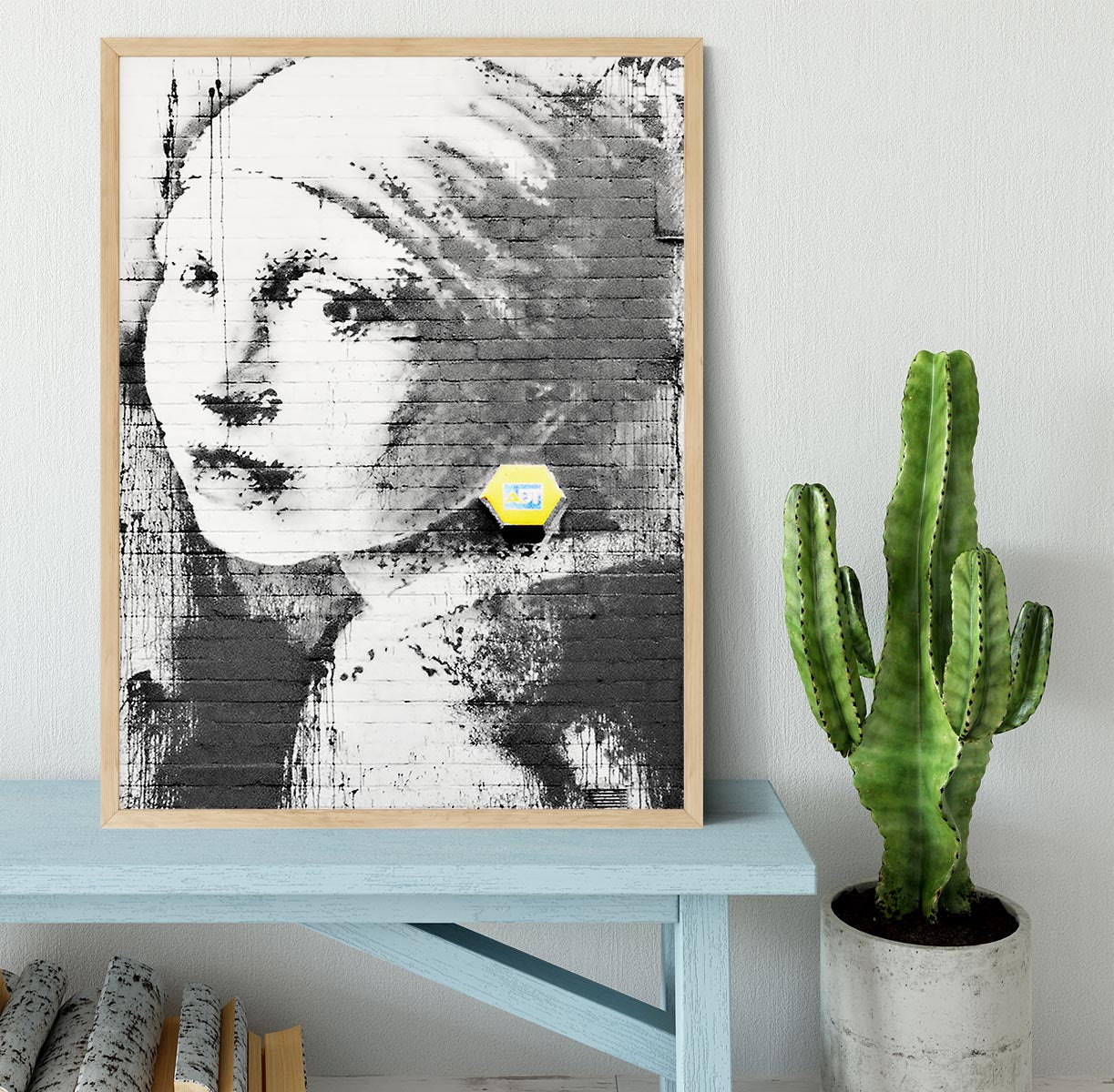 Banksy Girl With a Pierced Eardrum Framed Print