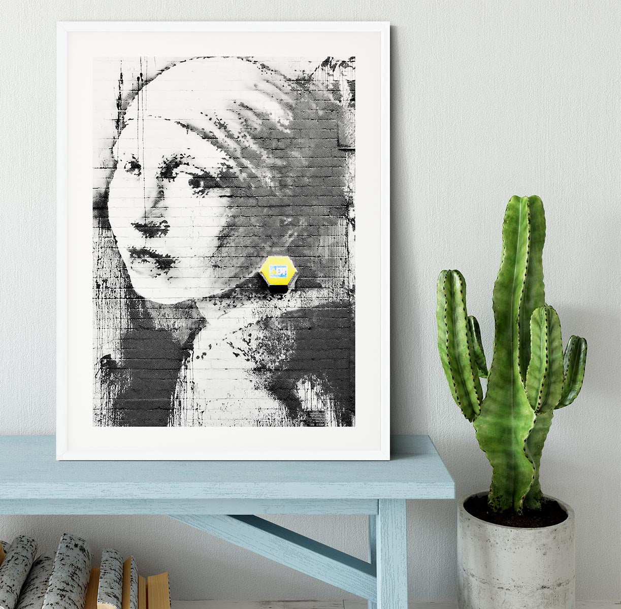 Banksy Girl With a Pierced Eardrum Framed Print