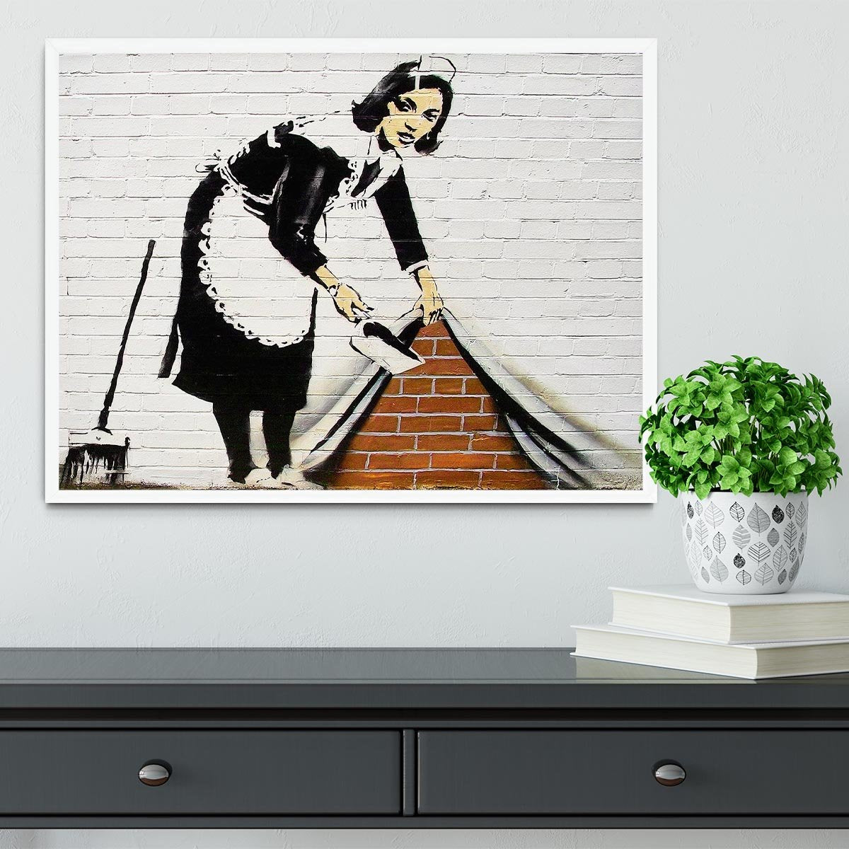 Banksy Maid Sweeping Under the Carpet Framed Print