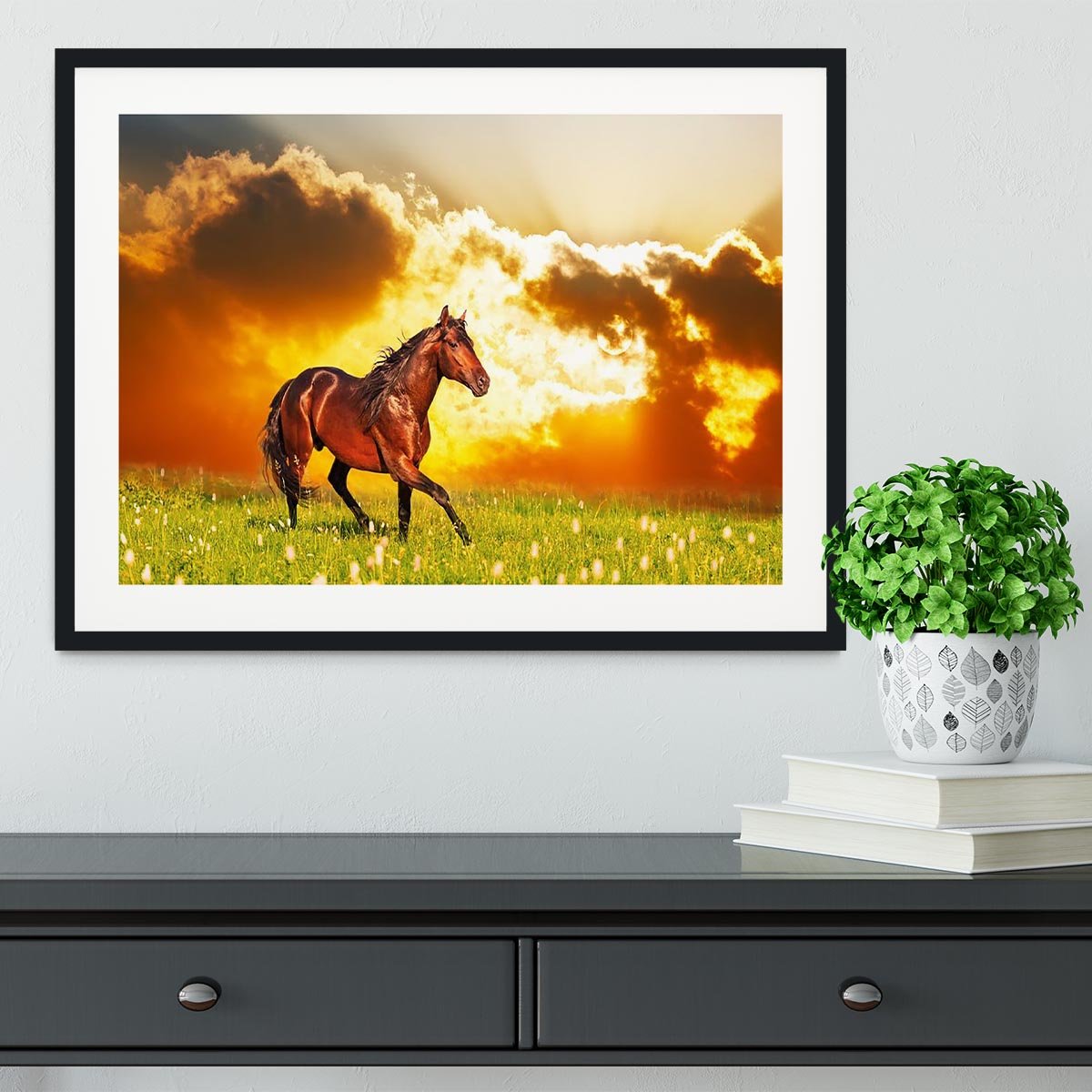 Bay horse skips on a meadow against a sunset Framed Print - Canvas Art Rocks - 1
