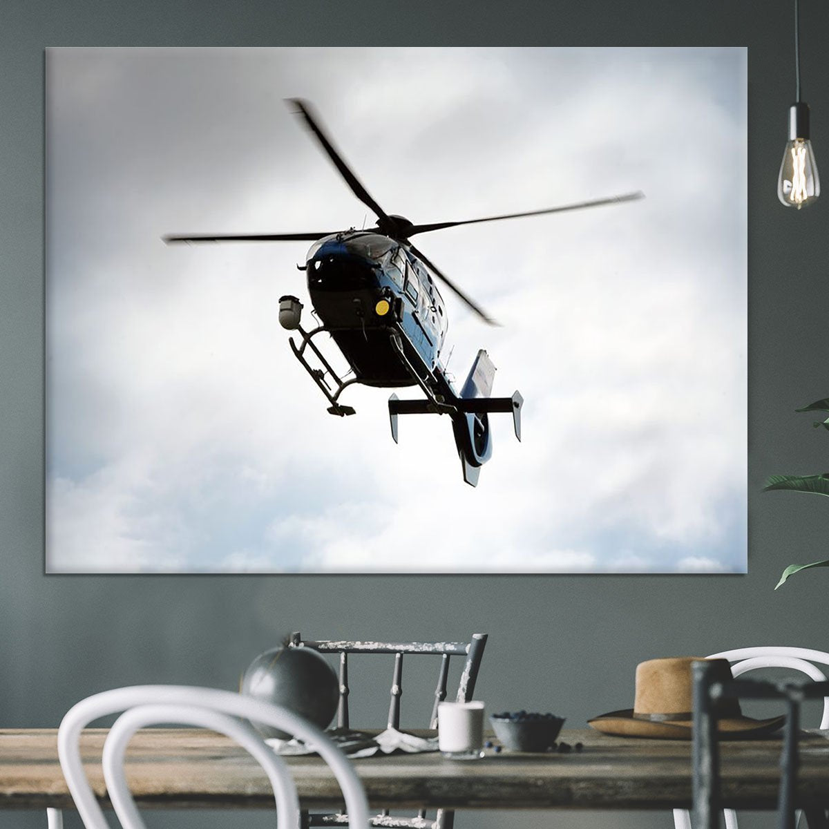 Blue and silver police helicopter flying above Canvas Print or Poster
