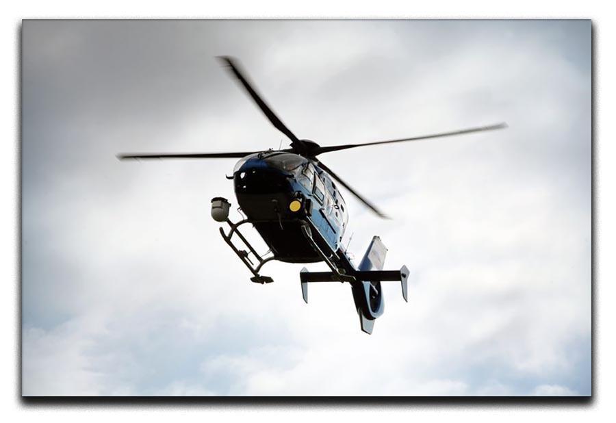 Blue and silver police helicopter flying above Canvas Print or Poster  - Canvas Art Rocks - 1