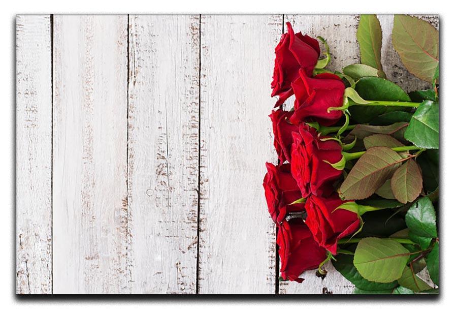 Bouquet of red roses on a light wooden background Canvas Print or Poster  - Canvas Art Rocks - 1