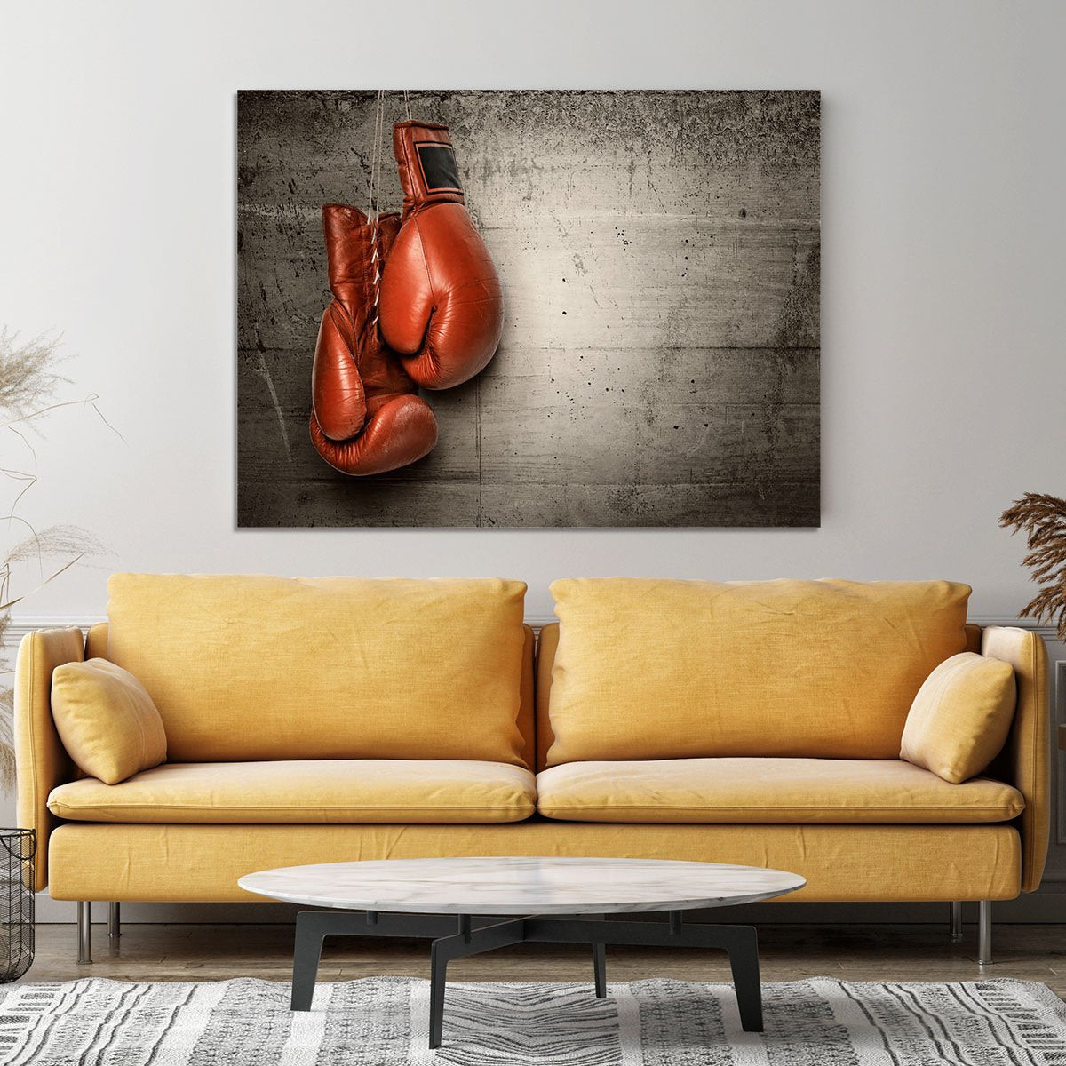 Boxing gloves hanging on concrete Canvas Print or Poster