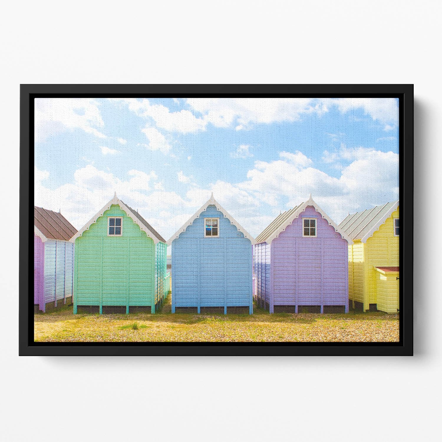 British beach huts on a bright sunny day Floating Framed Canvas