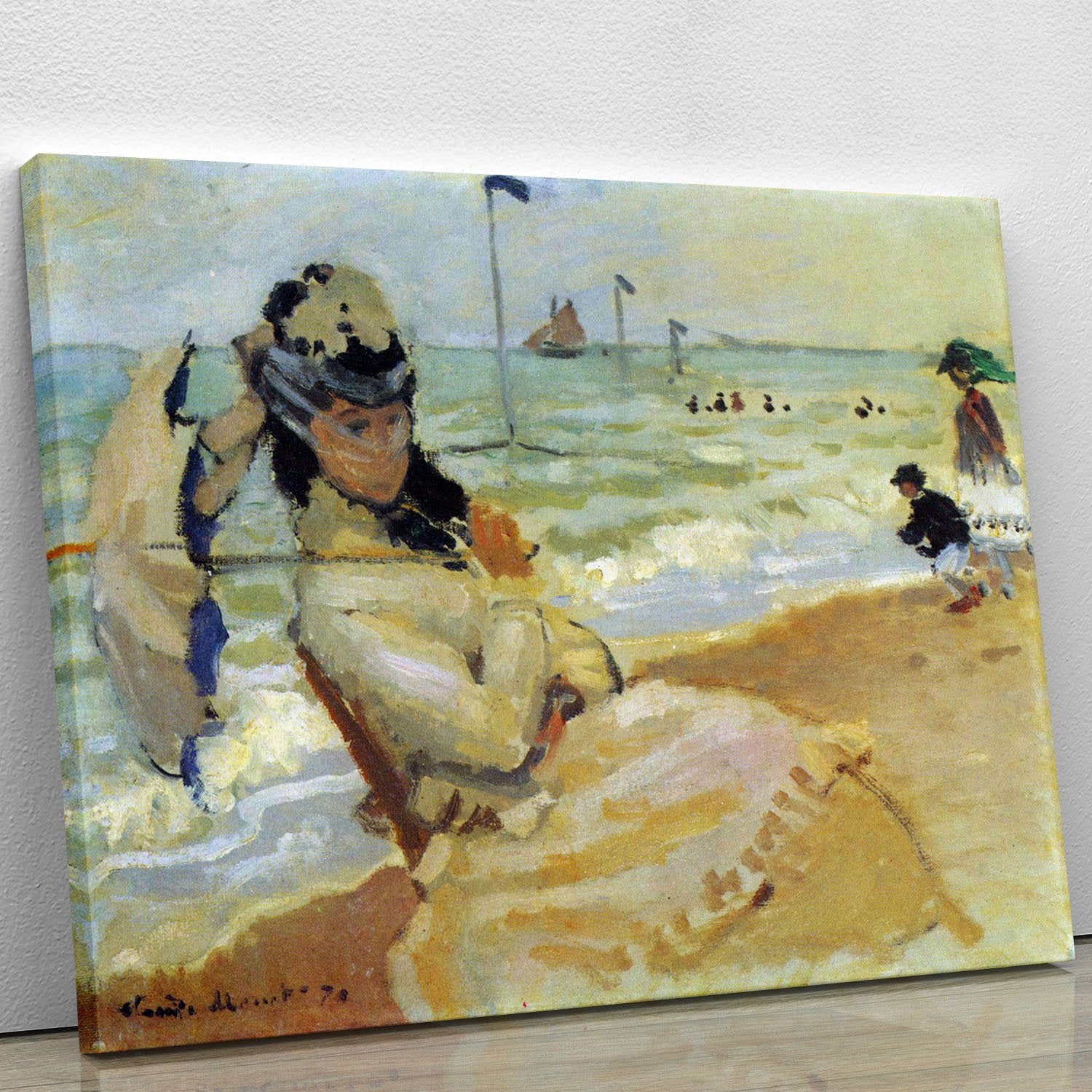 Camille on the beach at Trouville by Monet Canvas Print or Poster