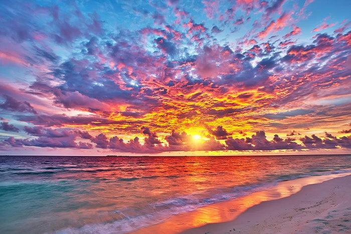 Colorful sunset over ocean on Maldives Wall Mural Wallpaper