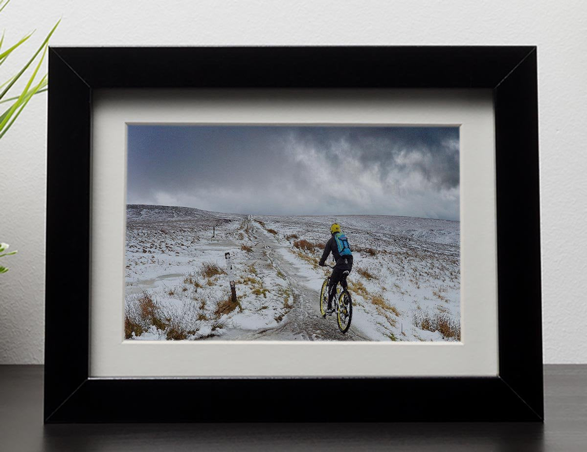 Cycling in the snow Framed Print - Canvas Art Rocks - 1