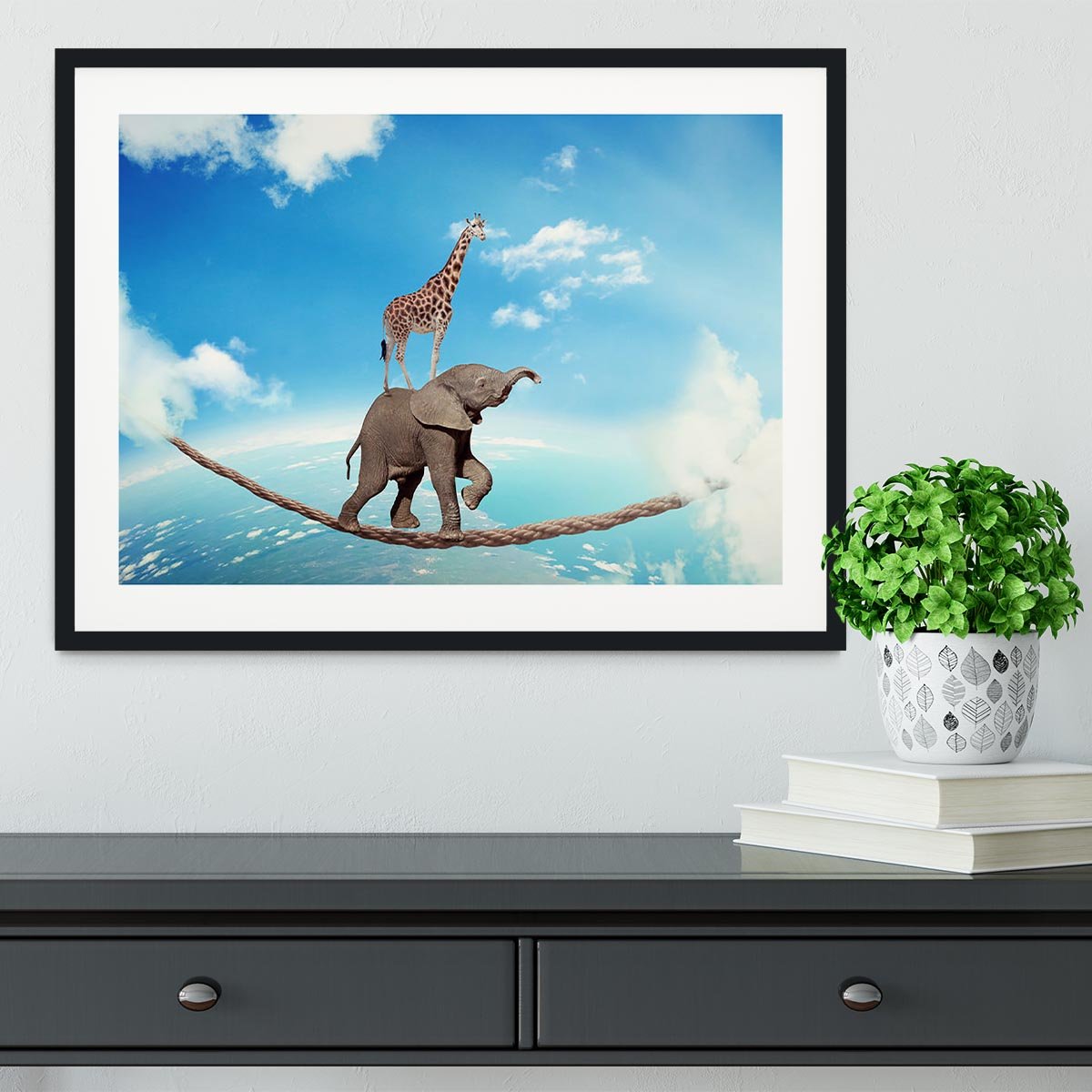 Elephant with giraffe walking on dangerous rope high in sky Framed Print - Canvas Art Rocks - 1