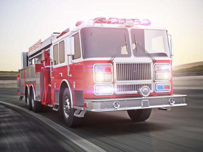 Fire truck running with lights and sirens Wall Mural Wallpaper
