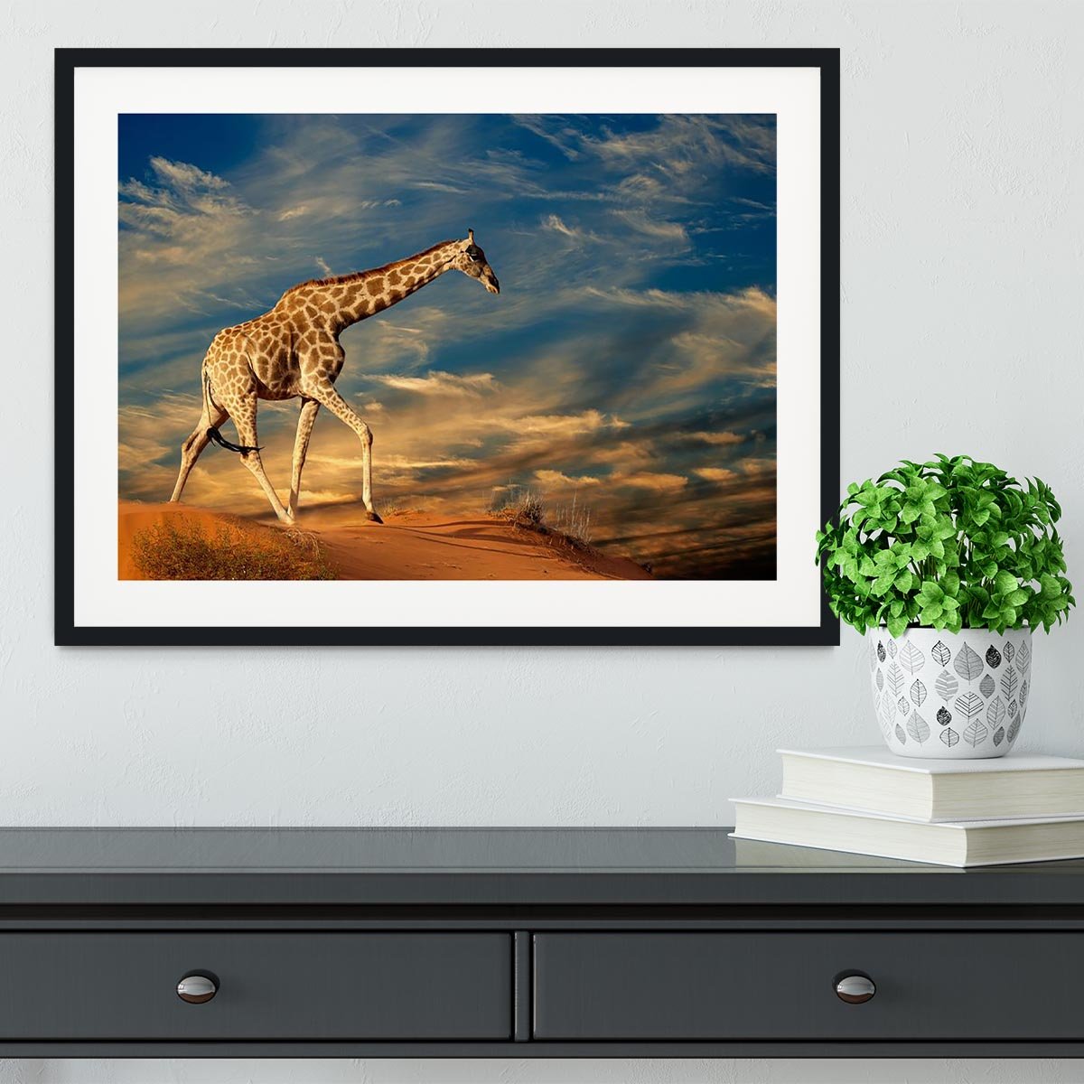 Giraffe walking on a sand dune with clouds South Africa Framed Print - Canvas Art Rocks - 1