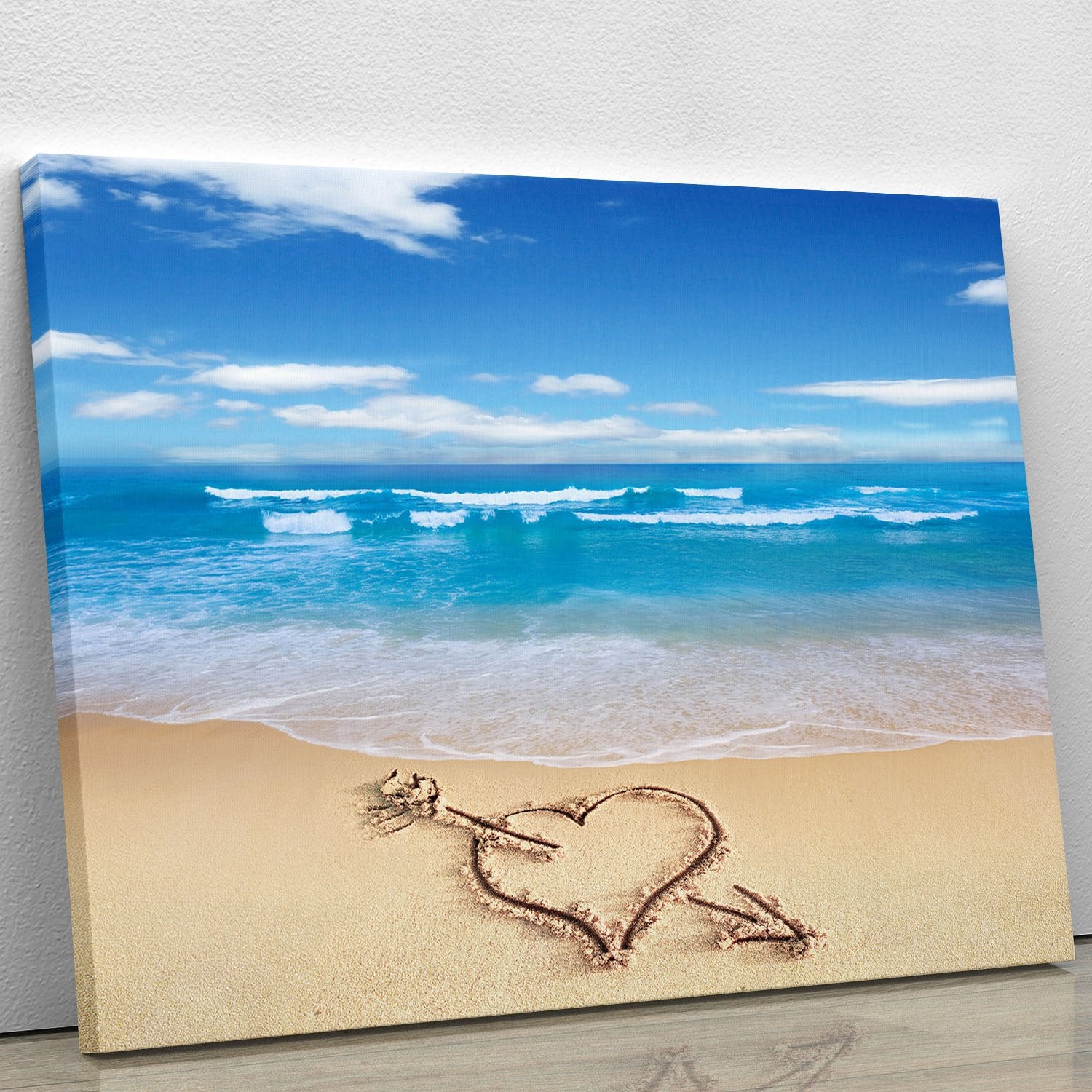 Heart with arrow in sand Canvas Print or Poster