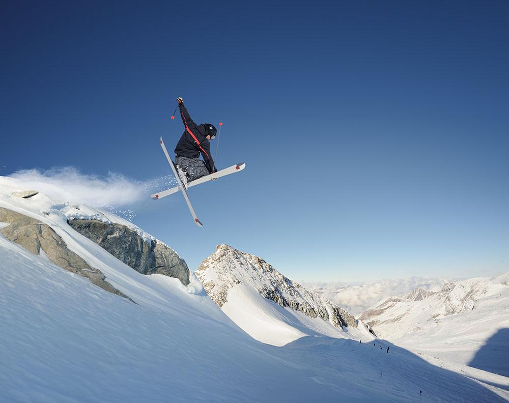 Jumping skier Wall Mural Wallpaper - Canvas Art Rocks - 1