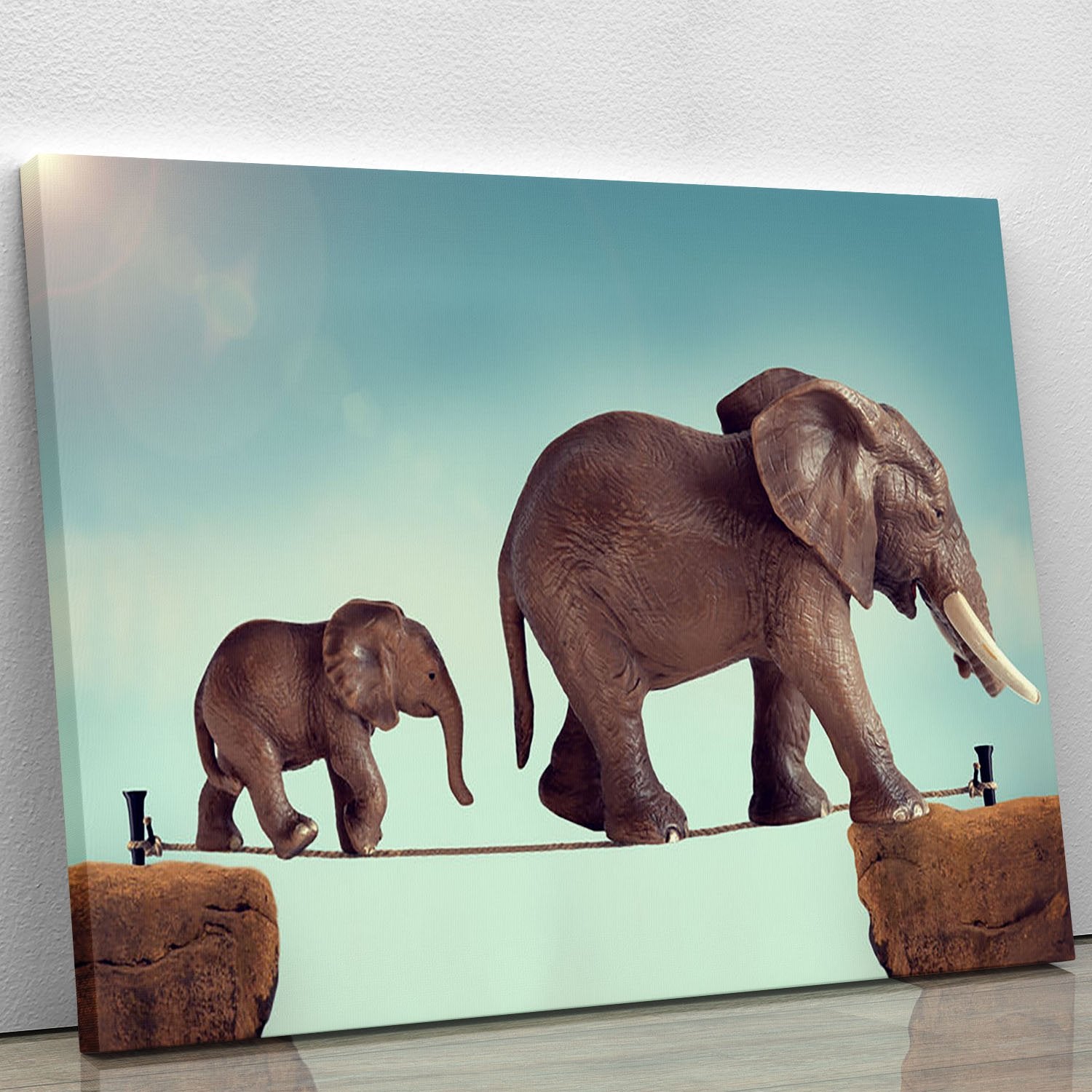Mother and baby elephant on a tightrope Canvas Print or Poster