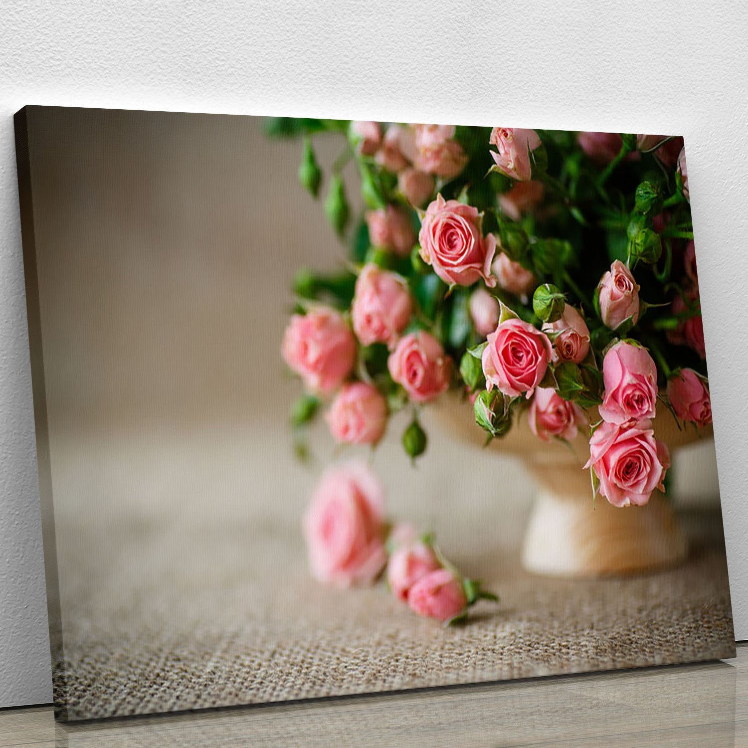 Pink roses on an old table of burlap Canvas Print or Poster