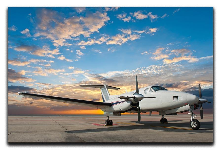 Propeller plane parking at the airport Canvas Print or Poster  - Canvas Art Rocks - 1