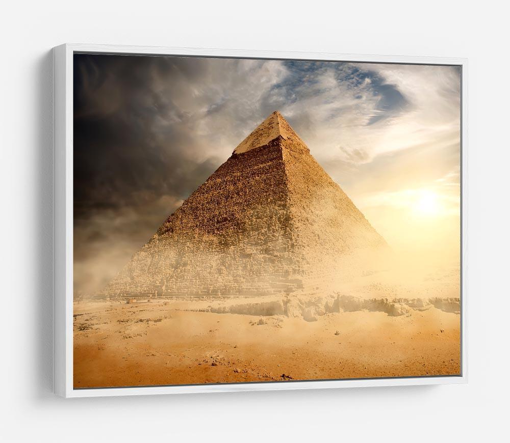 Pyramid in sand dust under clouds HD Metal Print