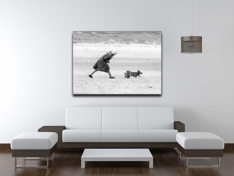 Queen Elizabeth II walking her pet corgis on a Norfolk beach Canvas Print or Poster - Canvas Art Rocks - 4