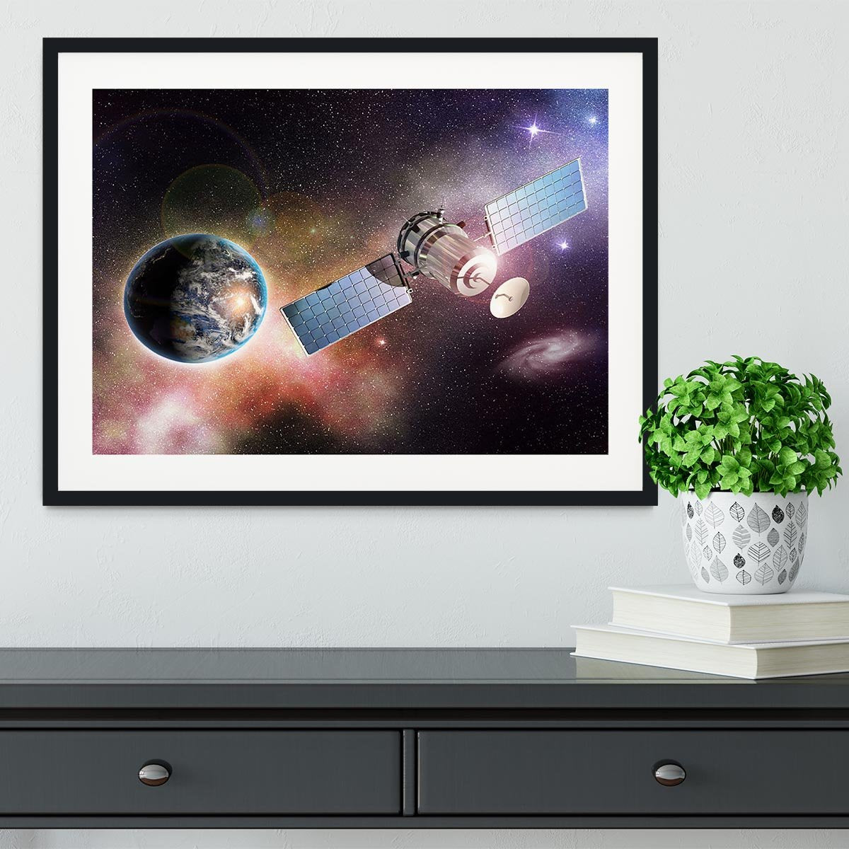 Satellite orbiting the earth in the outer space Framed Print - Canvas Art Rocks - 1