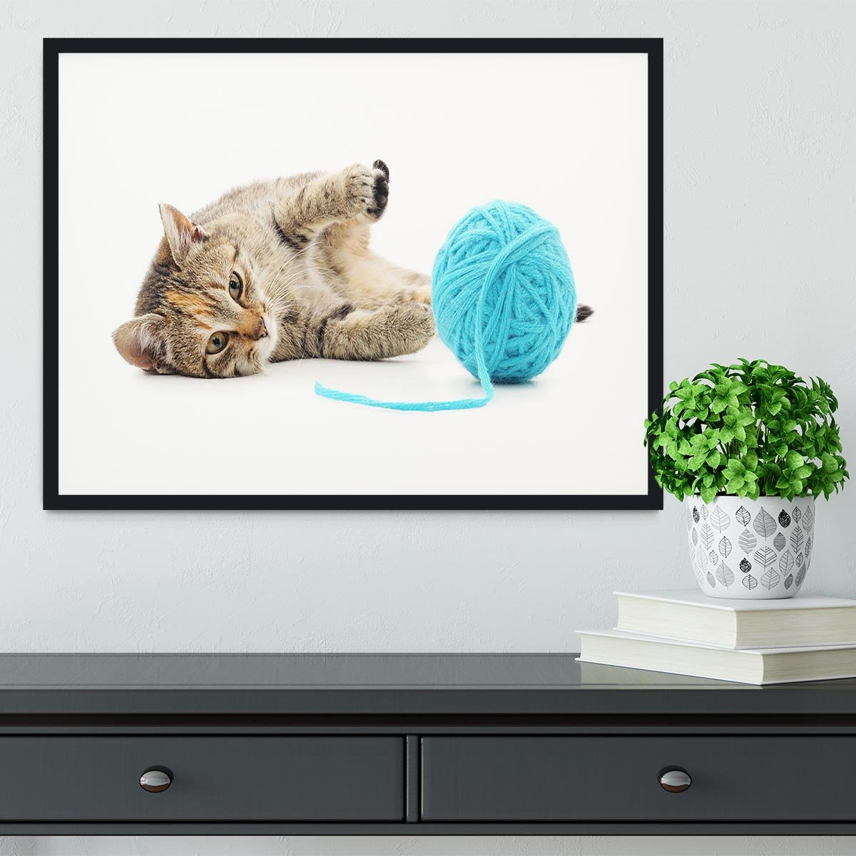 Small funny kitten and clew of thread Framed Print - Canvas Art Rocks - 1
