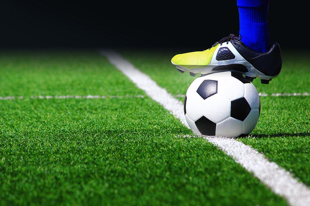 Soccer ball on field Wall Mural Wallpaper - Canvas Art Rocks - 1