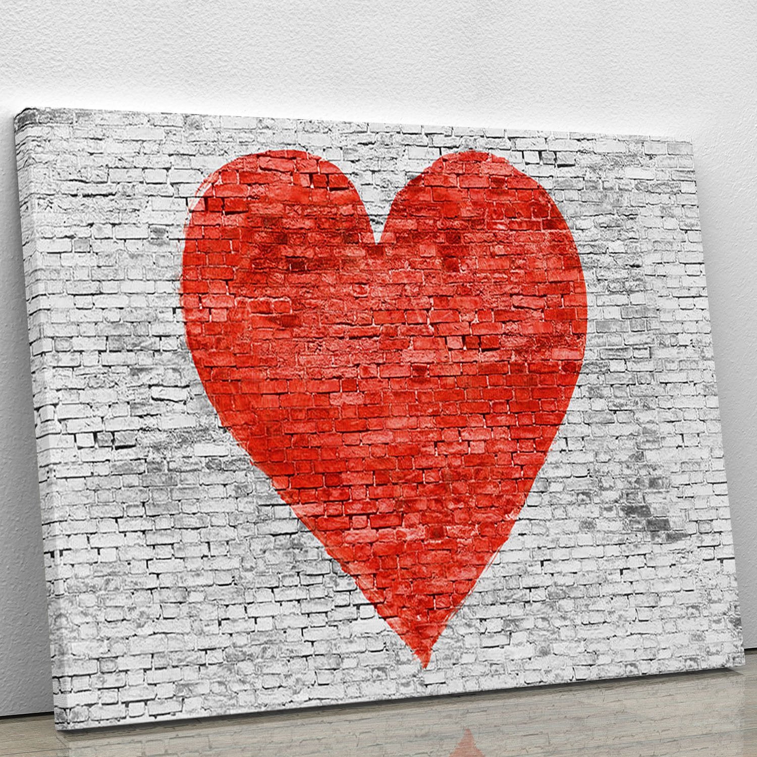Symbol of love painted on white brick Canvas Print or Poster