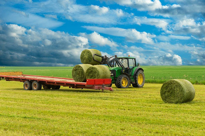 Tractor and trailer with hay bales Wall Mural Wallpaper