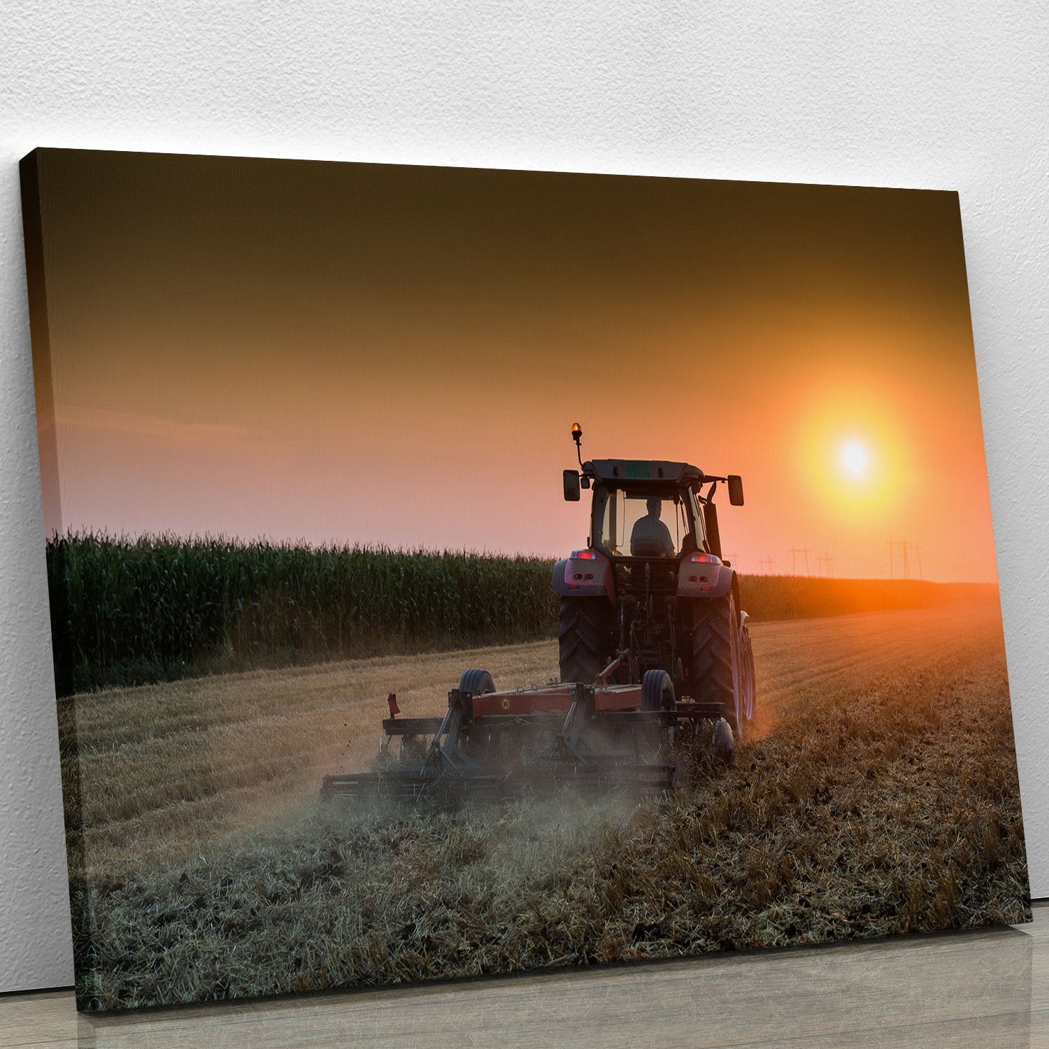 Tractor plowing field at dusk Canvas Print or Poster